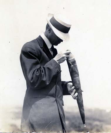 David Fairchild examining a bamboo shoot, unknown date